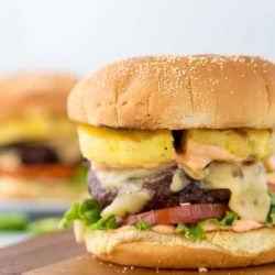 Pineapple jalapeno burger on a wooden board