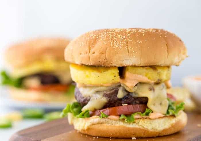 Pineapple jalapeno burger on a wooden board