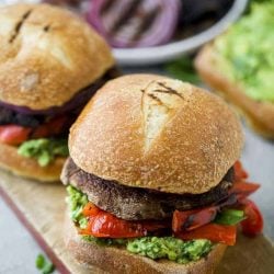 Two portobello burgers on a board