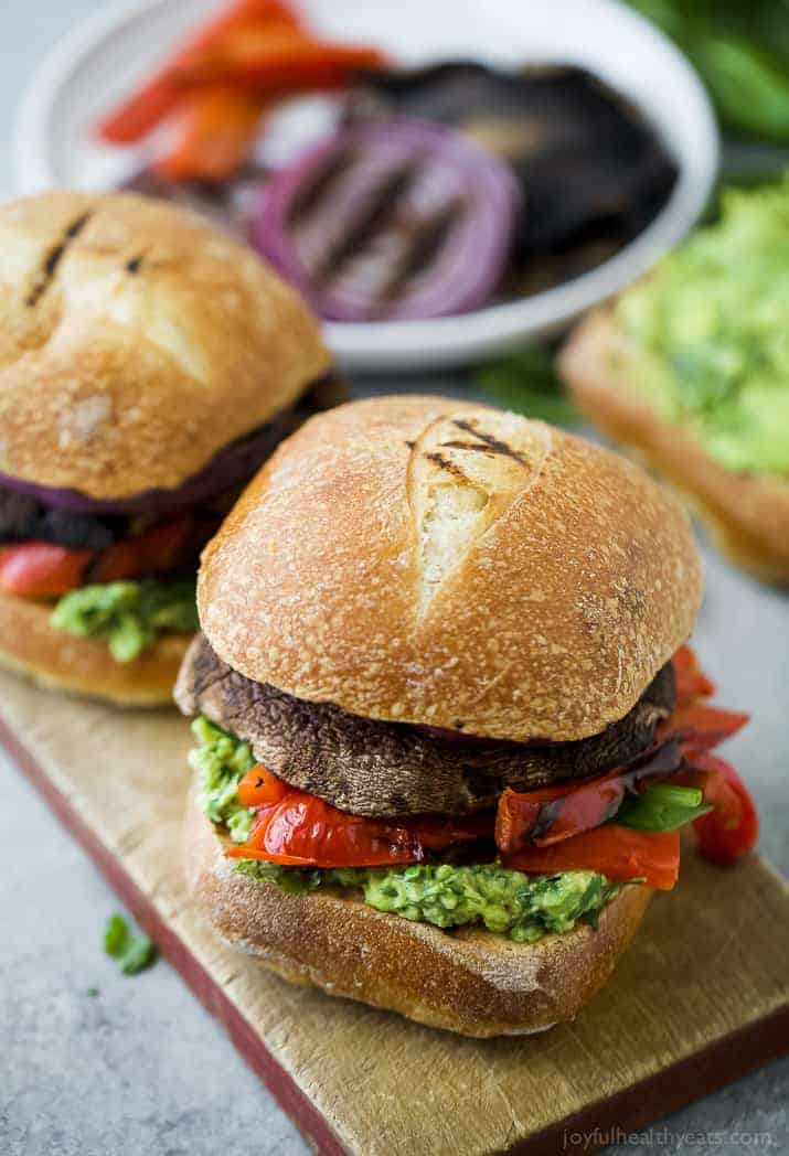 Two portobello burgers on a board