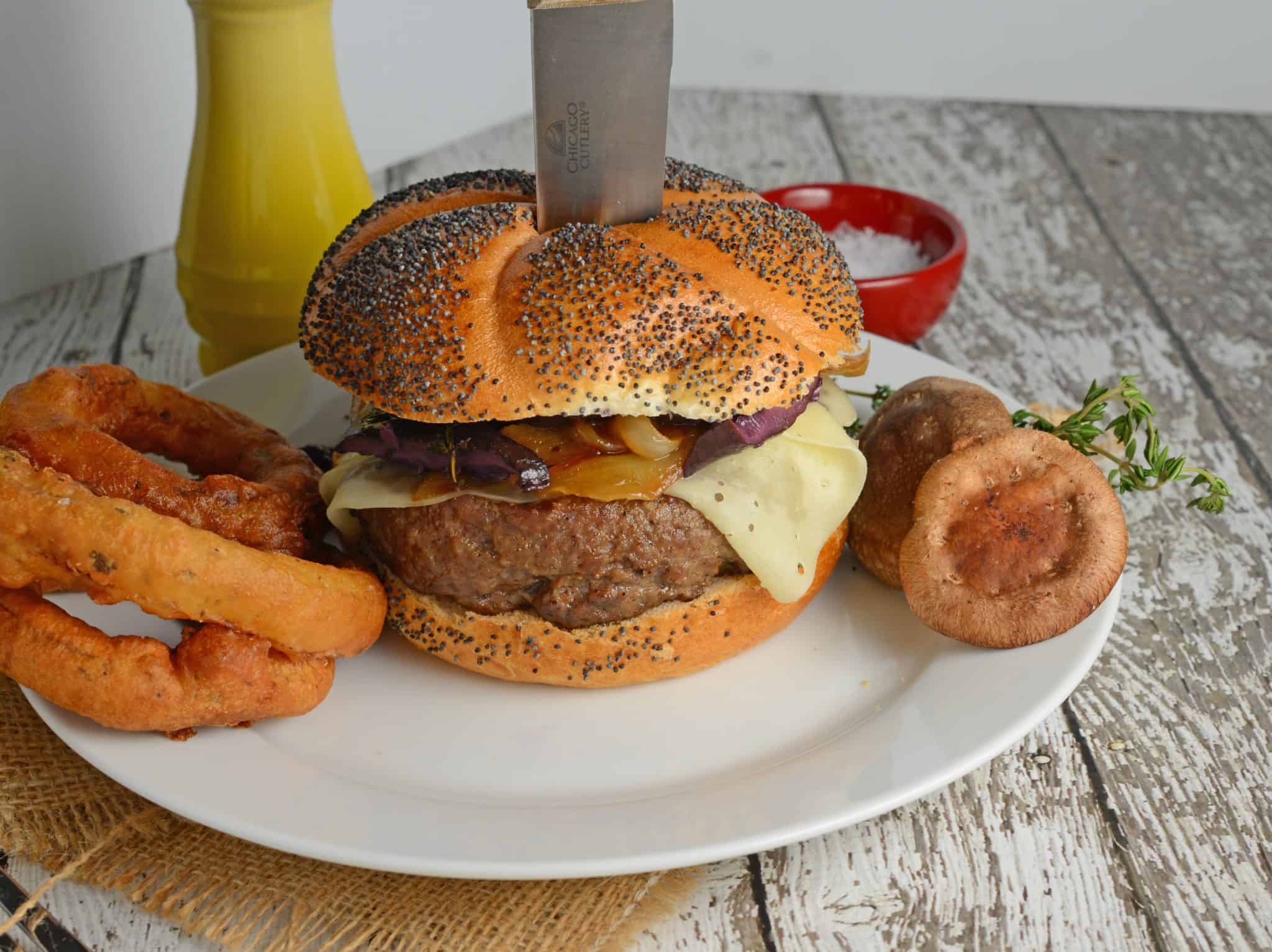 Red wine shiitake burger with a knife on a white plate