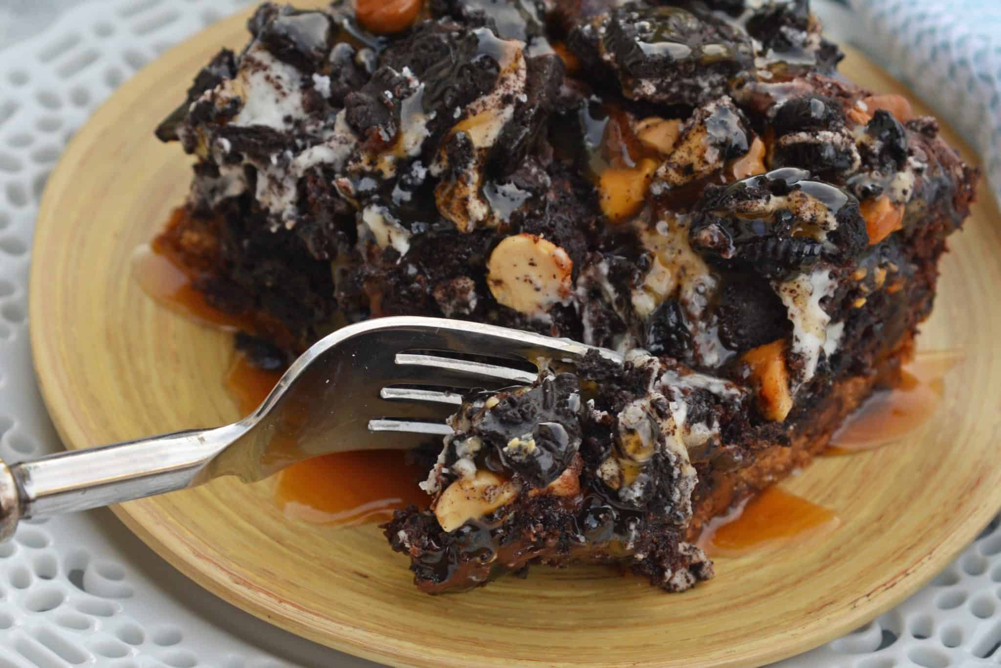 The Ultimate Slutty Brownies are layers of chocolate chip cookie dough, brownie, Oreo cookies, caramel and sea salt. The perfect decadent, sweet and salty easy dessert recipe. #sluttybrownies #bestbrownierecipe www.savoryexperiments.com