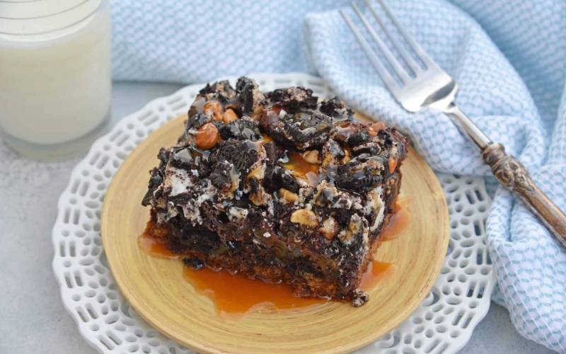 The Ultimate Slutty Brownies are layers of chocolate chip cookie dough, brownie, Oreo cookies, caramel and sea salt. The perfect decadent, sweet and salty easy dessert recipe. #sluttybrownies #bestbrownierecipe www.savoryexperiments.com