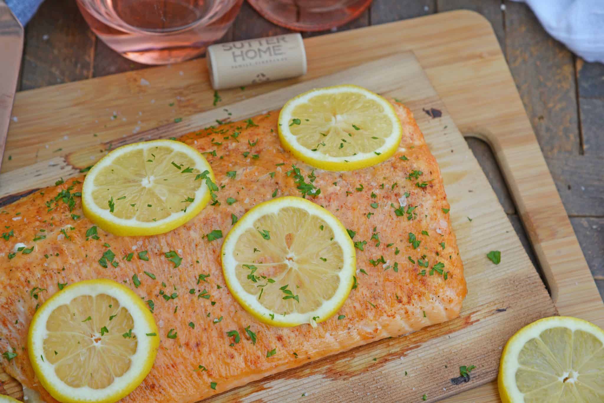 Spicy Cedar Plank Salmon is an easy grilled salmon recipe using a spicy salmon glaze. Perfect for a hot summer night and pairing with a crisp, sweet wine. #cedarplanksalmon #salmononthegrill #spicysalmon www.savoryexperiments.com