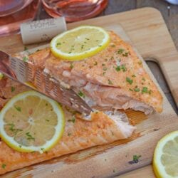 Spicy Cedar Plank Salmon is an easy grilled salmon recipe using a spicy salmon glaze. Perfect for a hot summer night and pairing with a crisp, sweet wine. #cedarplanksalmon #salmononthegrill #spicysalmon www.savoryexperiments.com