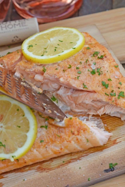 Spicy Cedar Plank Salmon is an easy grilled salmon recipe using a spicy salmon glaze. Perfect for a hot summer night and pairing with a crisp, sweet wine. #cedarplanksalmon #salmononthegrill #spicysalmon www.savoryexperiments.com