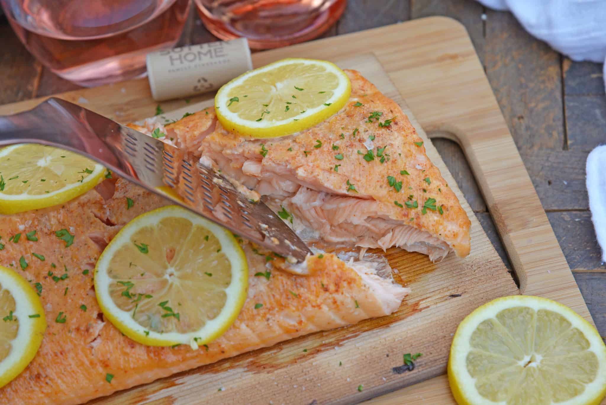 Spicy Cedar Plank Salmon is an easy grilled salmon recipe using a spicy salmon glaze. Perfect for a hot summer night and pairing with a crisp, sweet wine. #cedarplanksalmon #salmononthegrill #spicysalmon www.savoryexperiments.com