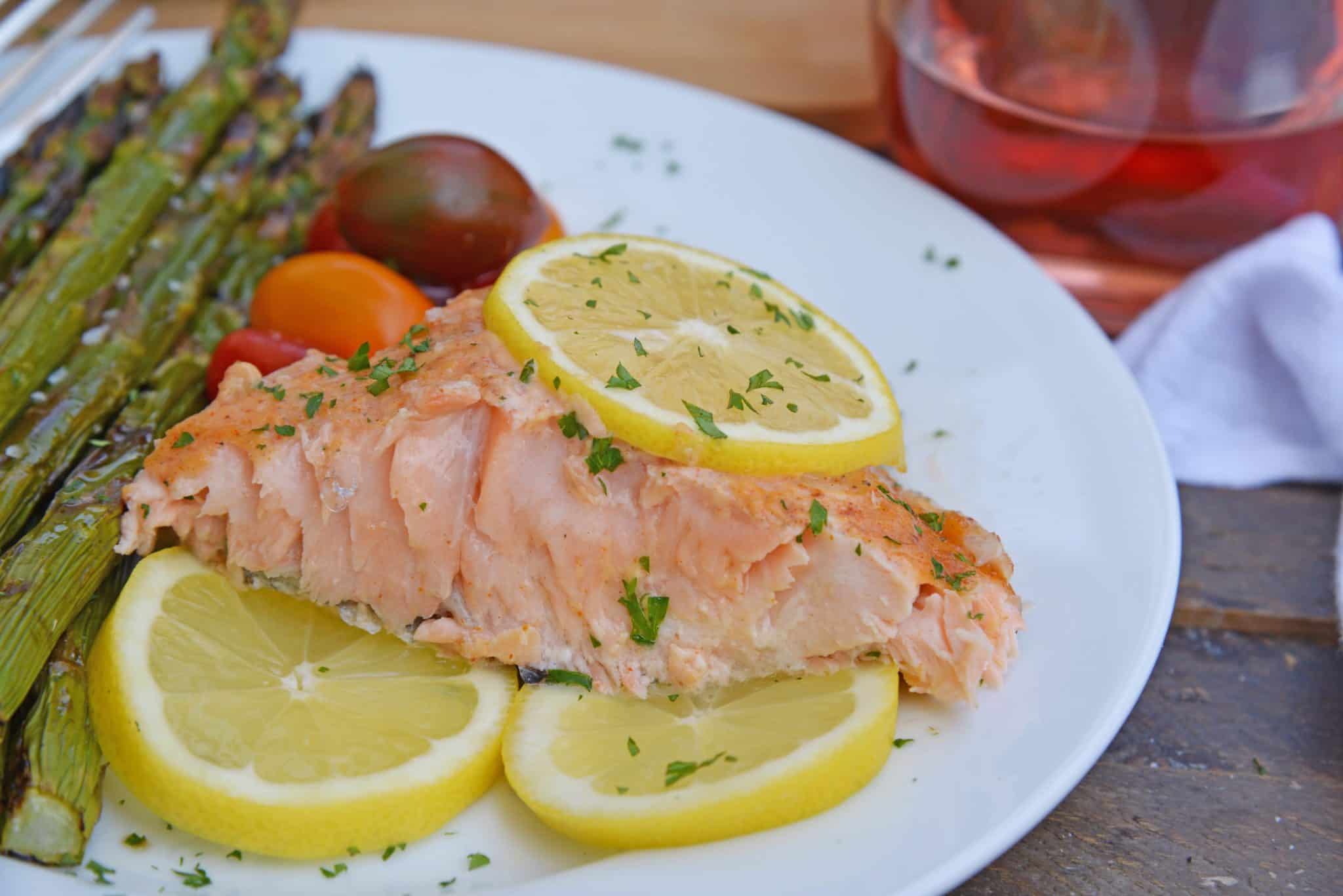 Spicy Cedar Plank Salmon is an easy grilled salmon recipe using a spicy salmon glaze. Perfect for a hot summer night and pairing with a crisp, sweet wine. #cedarplanksalmon #salmononthegrill #spicysalmon www.savoryexperiments.com