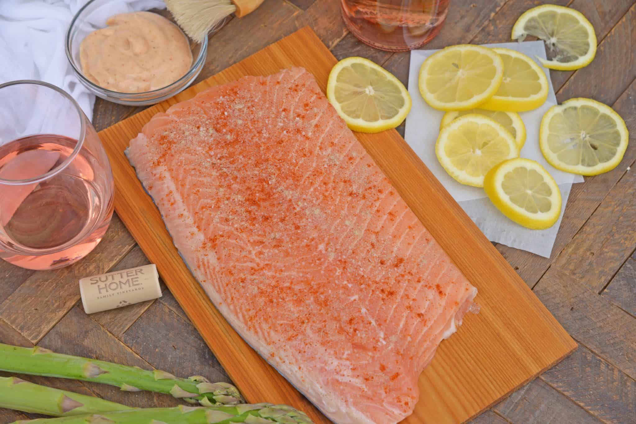 Spicy Cedar Plank Salmon is an easy grilled salmon recipe using a spicy salmon glaze. Perfect for a hot summer night and pairing with a crisp, sweet wine. #cedarplanksalmon #salmononthegrill #spicysalmon www.savoryexperiments.com