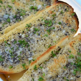 This Truffle Butter Garlic Bread is unlike any homemade garlic bread you've tasted. So delicious and made with just 3 ingredients! #trufflebutter #homemadegarlicbread www.savoryexperiments.com