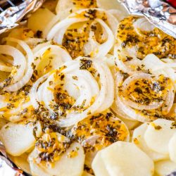 overhead shot of cheesy potatoes in foil pack