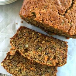 A loaf of carrot zucchini bread cut into slices