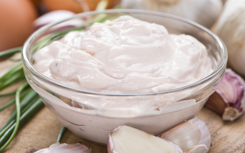angled shot of bowl of aioli