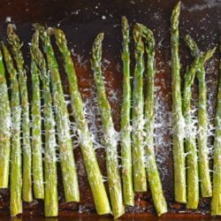 This delicious Asiago Asparagus is a quick and easy roasted asparagus recipe requiring only 4 ingredients and 15 minutes to prepare. #howtomakeasparagus #roastedasparagus www.savoryexperiments.com