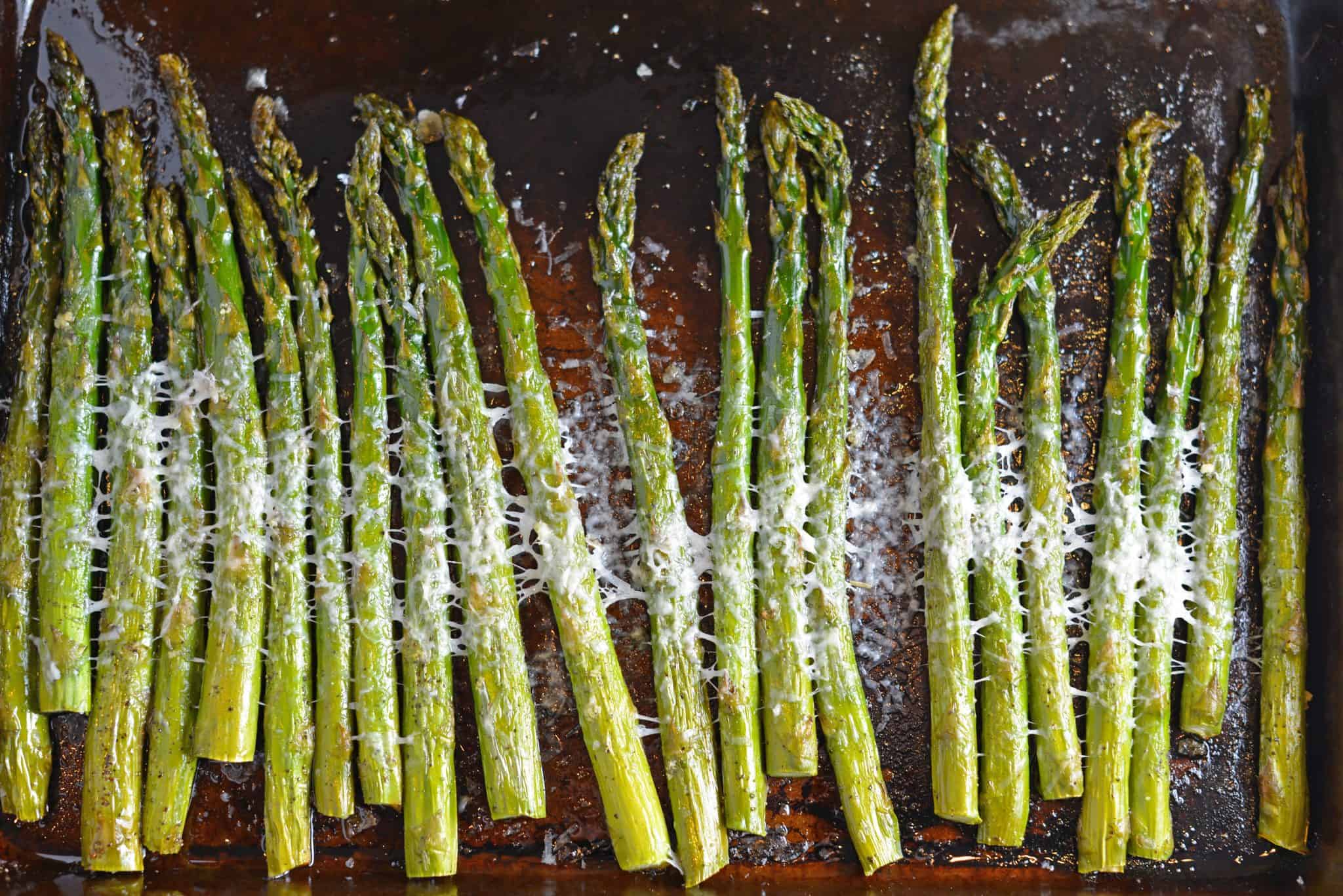 This delicious Asiago Asparagus is a quick and easy roasted asparagus recipe requiring only 4 ingredients and 15 minutes to prepare. #howtomakeasparagus #roastedasparagus www.savoryexperiments.com