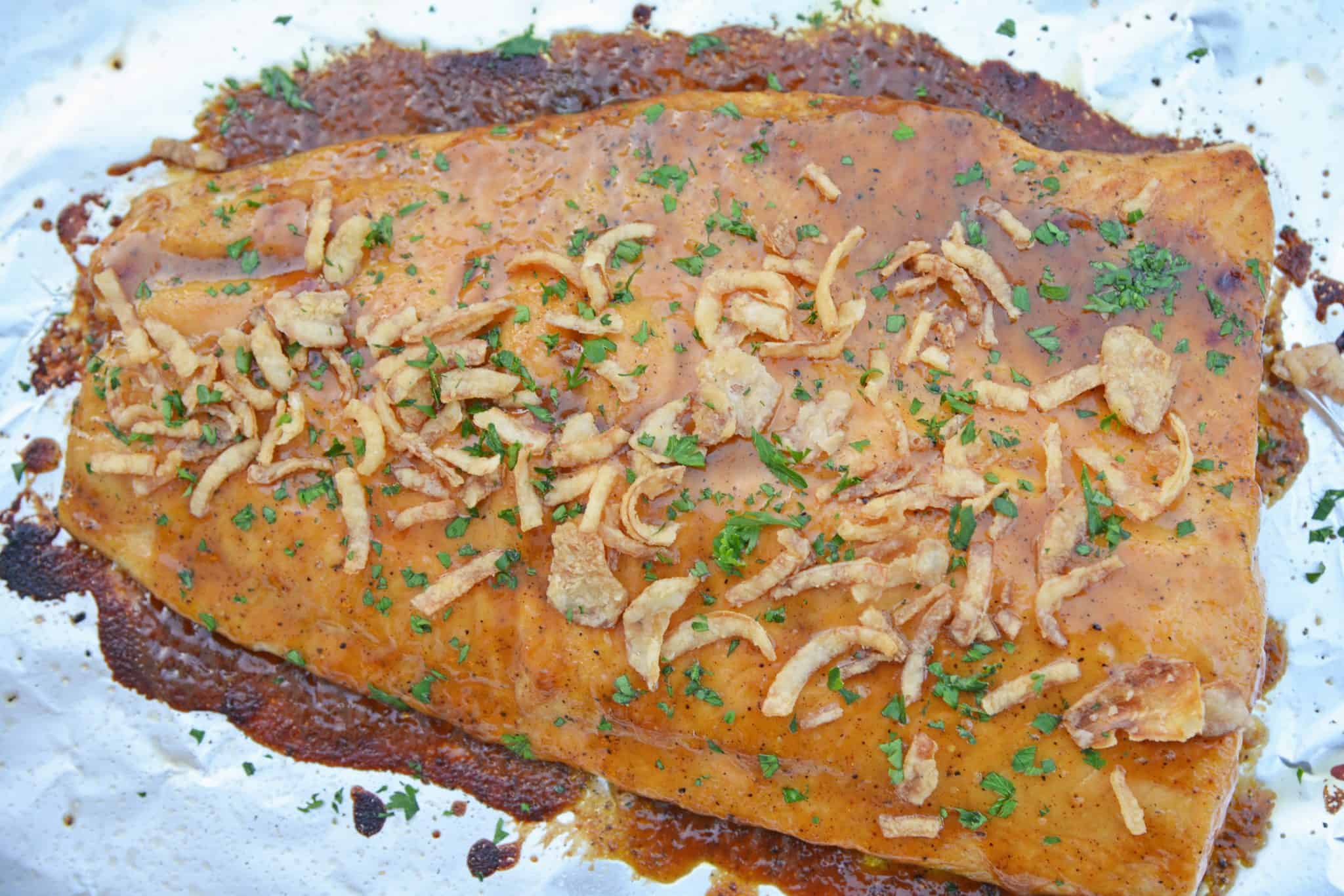 This BBQ Baked Salmon requires just 20 minutes and a handful of ingredients. Flavorful, quick and easy! Sure to become your favorite salmon recipe. #bakedsalmon #salmonrecipes www.savoryexperiments.com