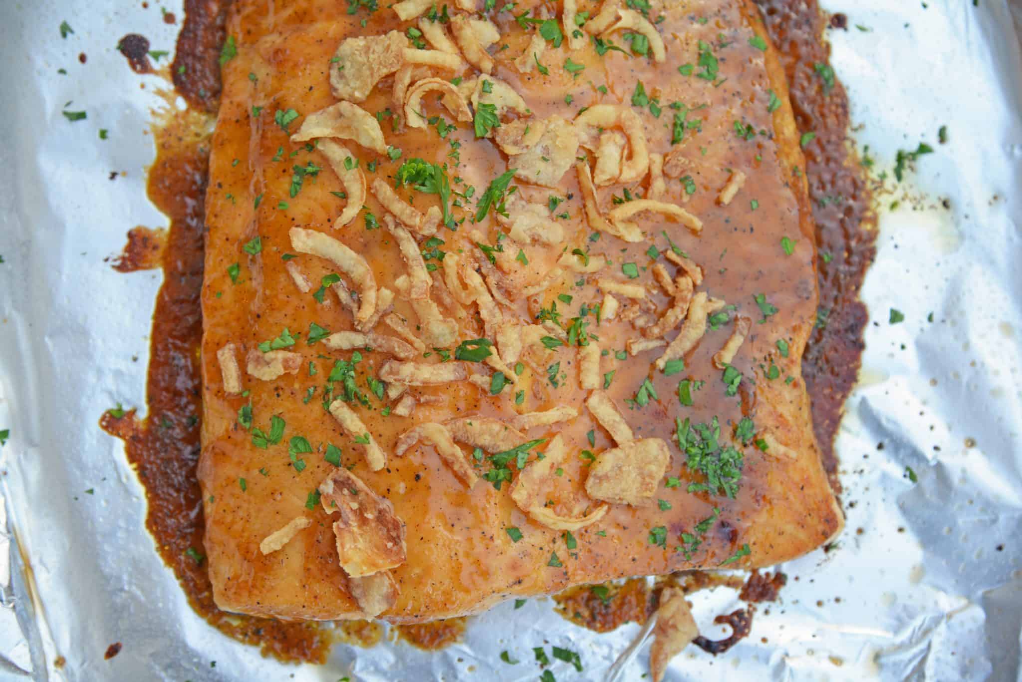 This BBQ Baked Salmon requires just 20 minutes and a handful of ingredients. Flavorful, quick and easy! Sure to become your favorite salmon recipe. #bakedsalmon #salmonrecipes www.savoryexperiments.com