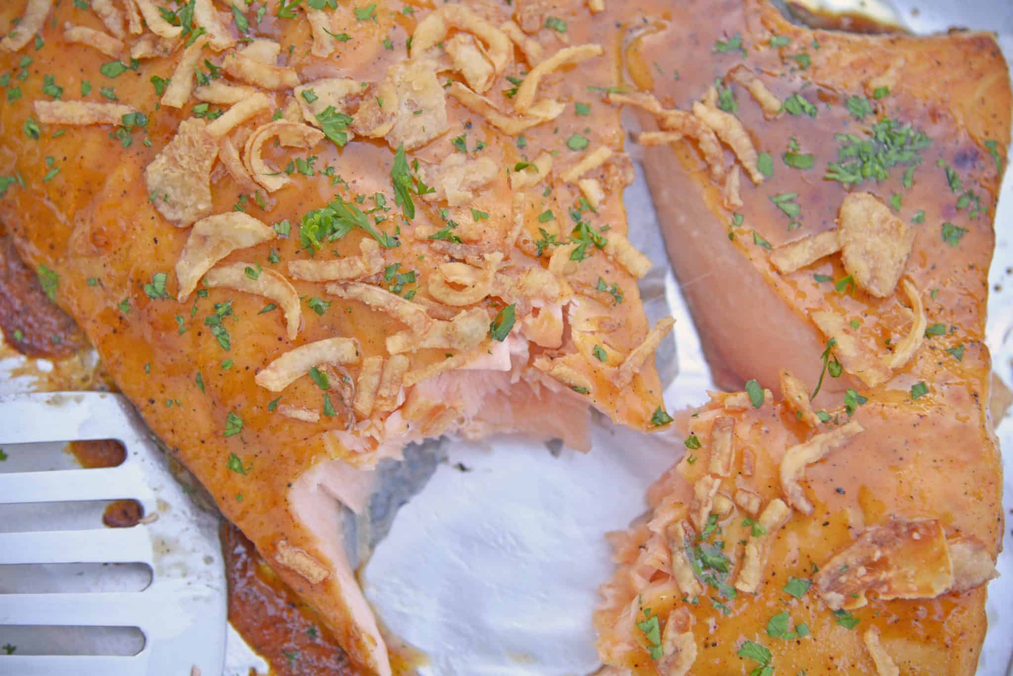 This BBQ Baked Salmon requires just 20 minutes and a handful of ingredients. Flavorful, quick and easy! Sure to become your favorite salmon recipe. #bakedsalmon #salmonrecipes www.savoryexperiments.com