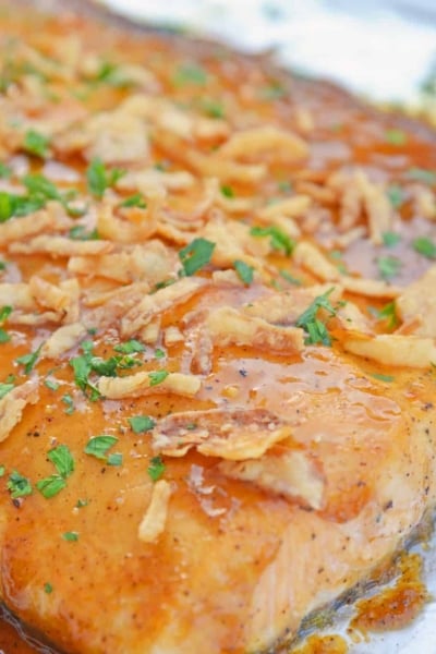 This BBQ Baked Salmon requires just 20 minutes and a handful of ingredients. Flavorful, quick and easy! Sure to become your favorite salmon recipe. #bakedsalmon #salmonrecipes www.savoryexperiments.com