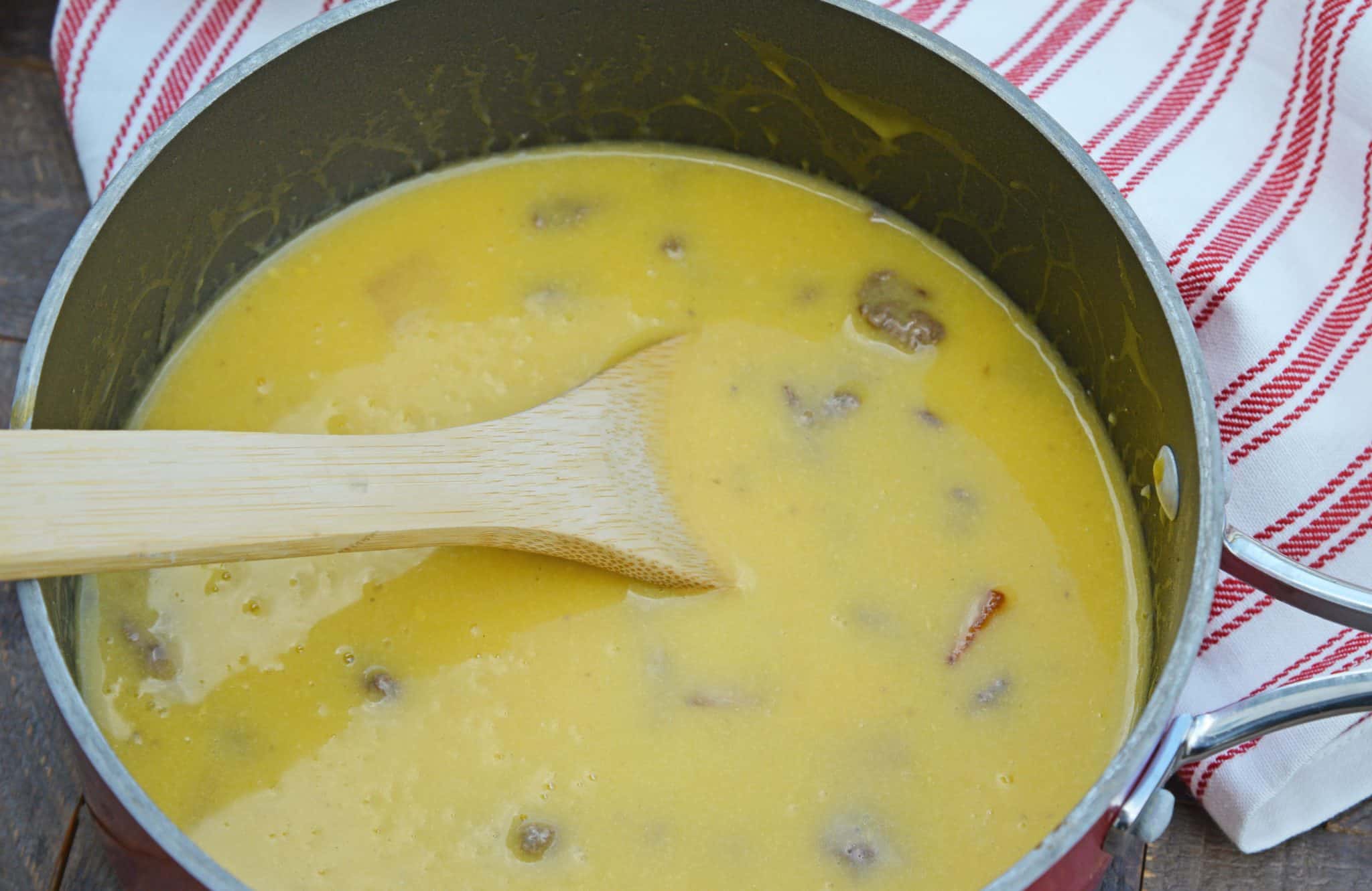 Bacon Cheeseburger Soup takes classic Cheeseburger Soup and adds BACON! Your favorite comfort food in soup form, does it get any better? #baconcheeseburgersoup #cheeseburgersoup www.savoryexperiments.com 