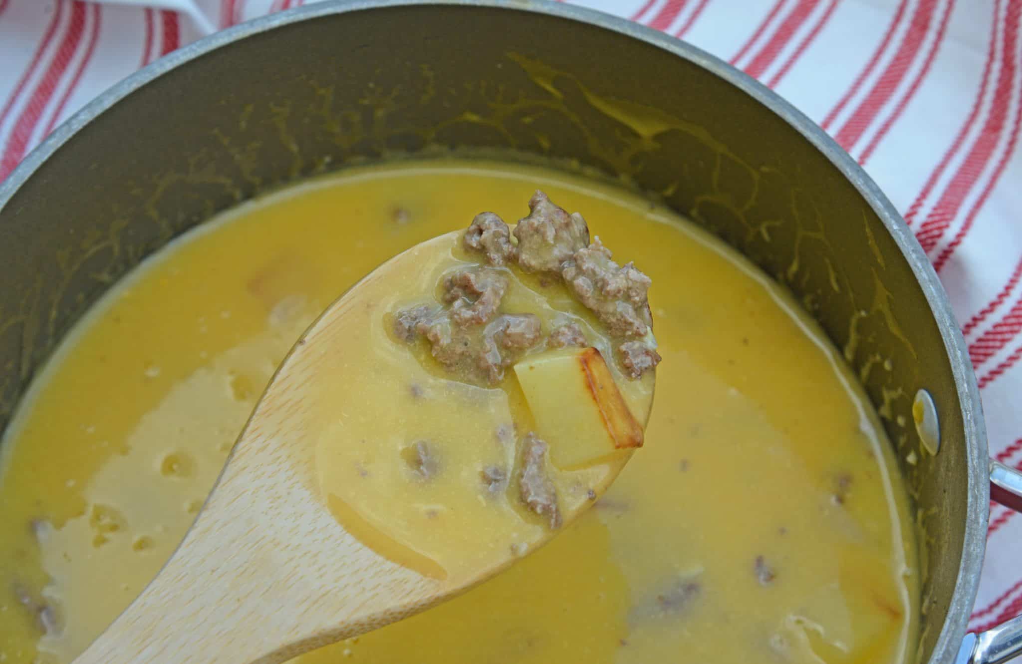 Bacon Cheeseburger Soup takes classic Cheeseburger Soup and adds BACON! Your favorite comfort food in soup form, does it get any better? #baconcheeseburgersoup #cheeseburgersoup www.savoryexperiments.com