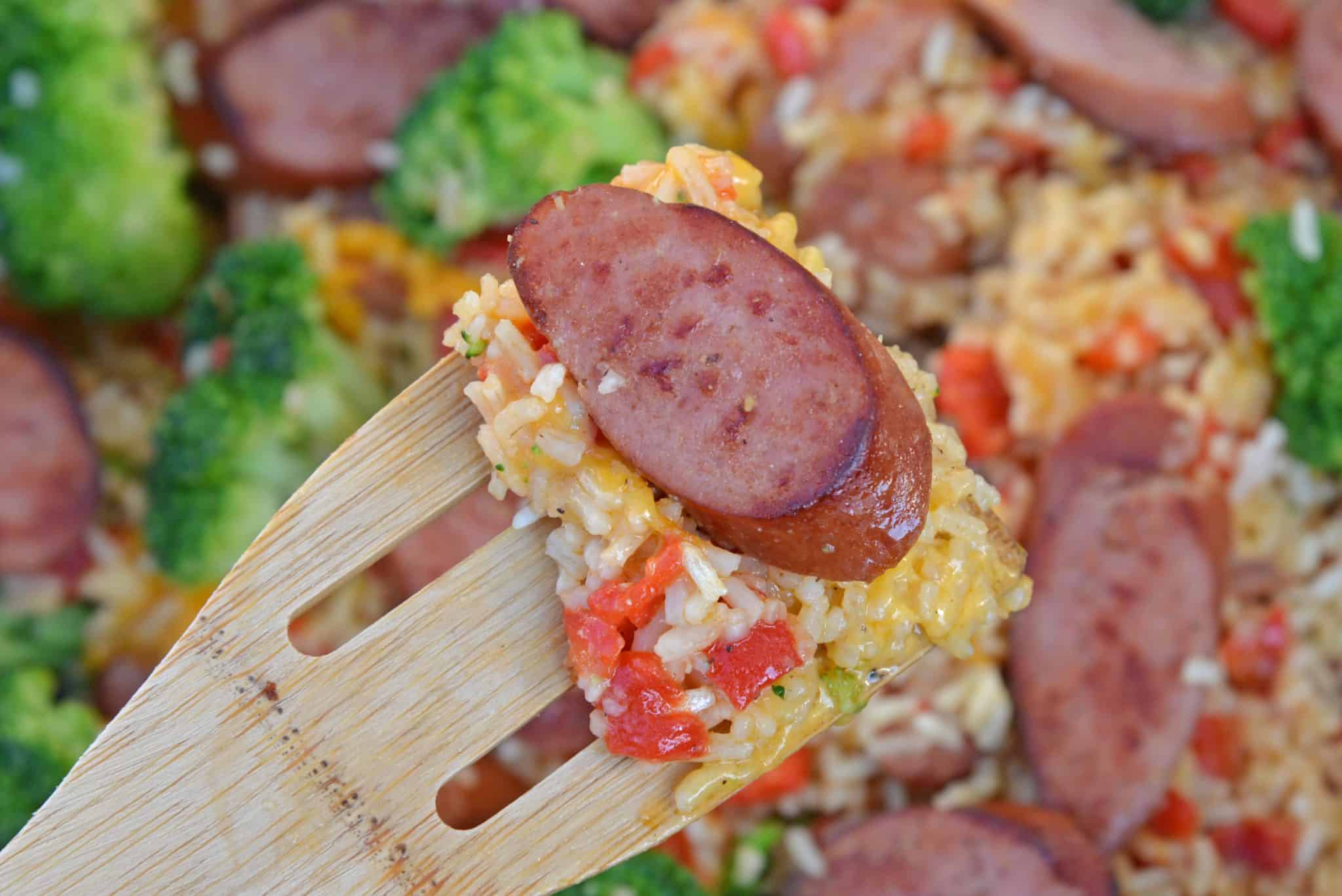 Sharp cheddar cheese tossed with rice, broccoli florets, roasted red pepper and tender Eckrich Smoked Sausage. Dinner is ready in just 15 minutes! #easydinnerideas #skilletmeals #onepandinner www.savoryexperiments.com 