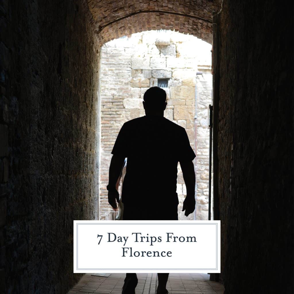 Man walking through a dark tunnel
