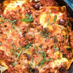 Greek lasagna in a cast iron skillet