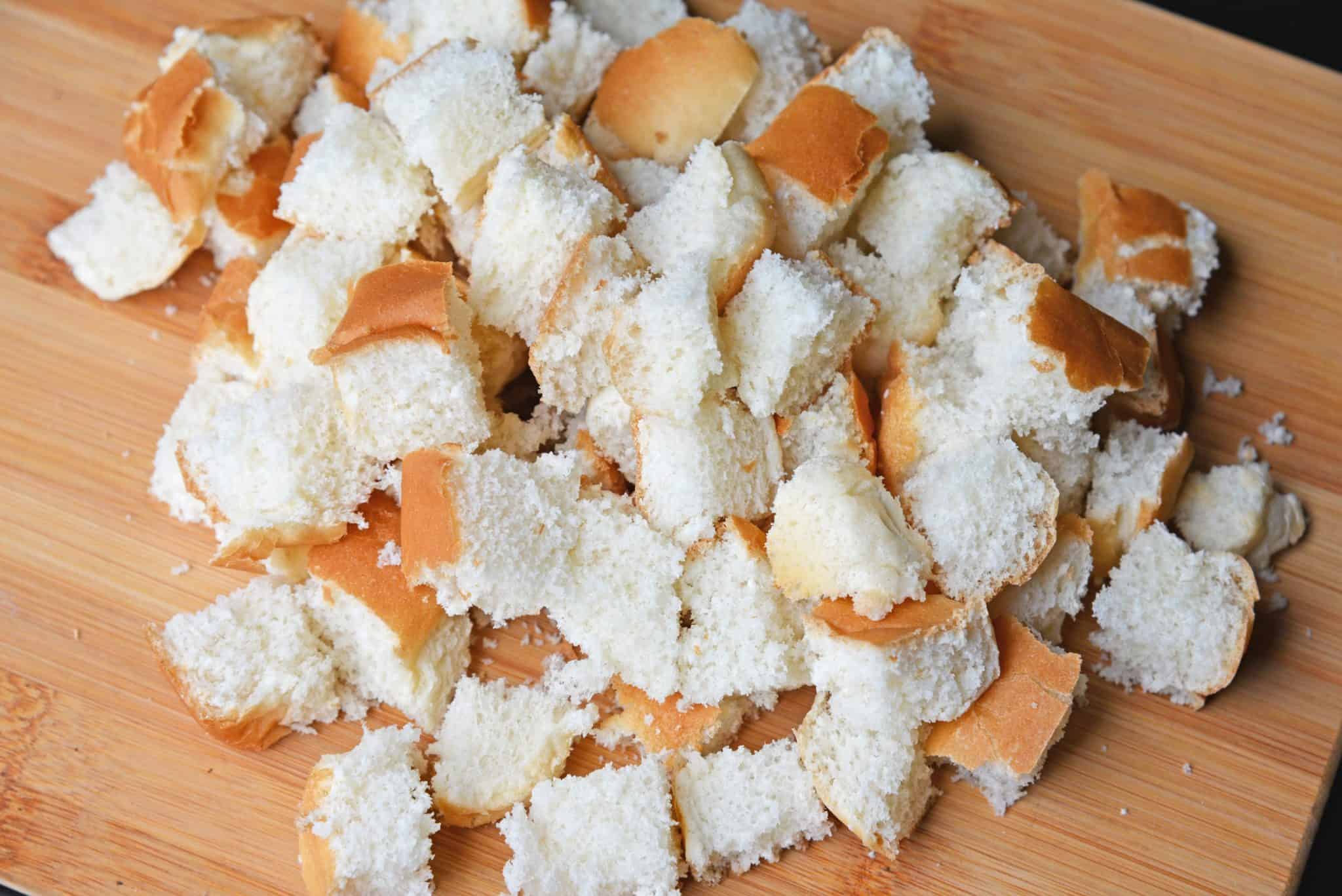 Hot Dog Bun Homemade Croutons with garlic, salt and parsley are the best for salads, soup and more! Learn how to make croutons easily with this crouton recipe. #homemadecroutons #croutonrecipe #howtomakecroutons www.savoryexperiments.com