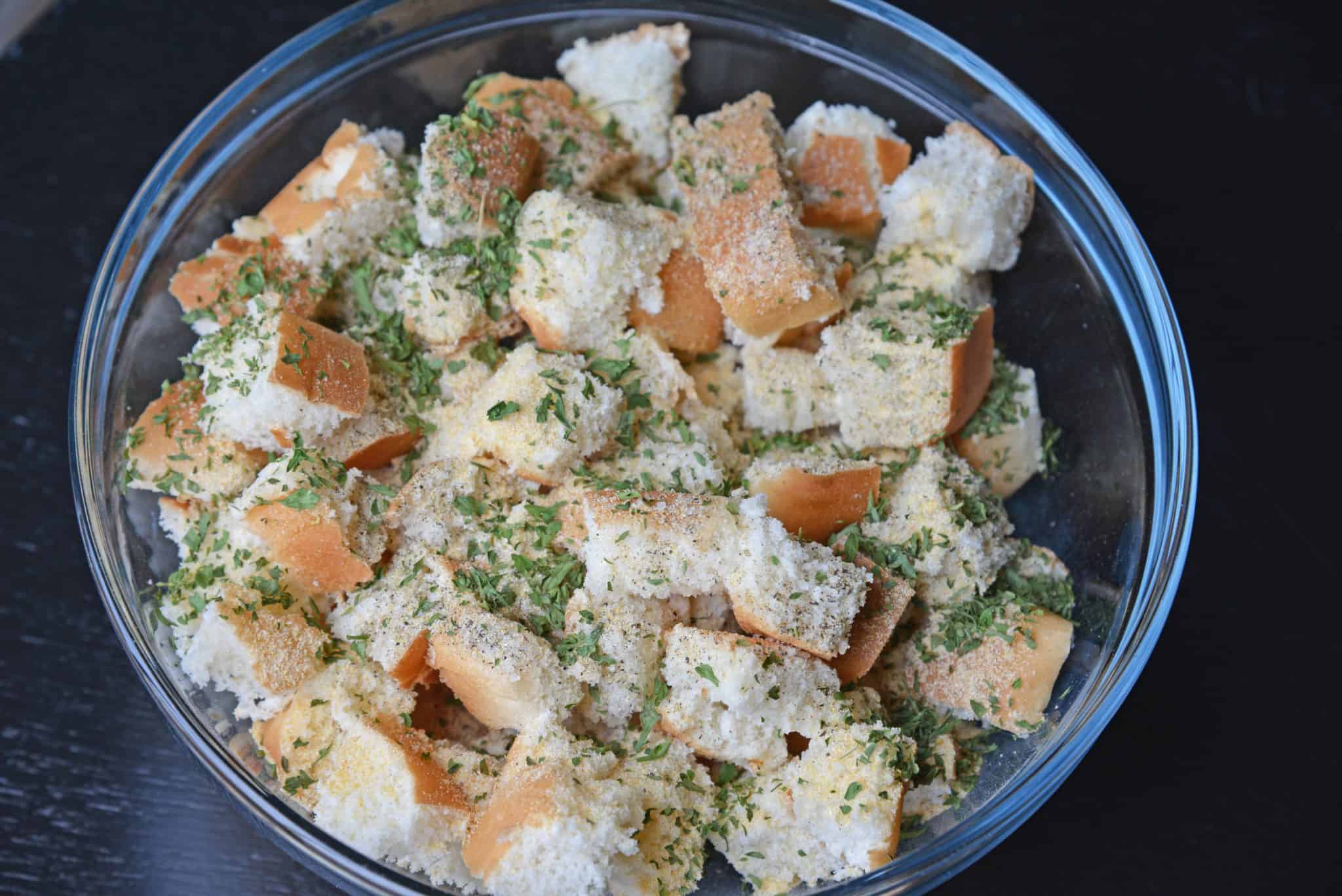 Hot Dog Bun Homemade Croutons with garlic, salt and parsley are the best for salads, soup and more! Learn how to make croutons easily with this crouton recipe. #homemadecroutons #croutonrecipe #howtomakecroutons www.savoryexperiments.com