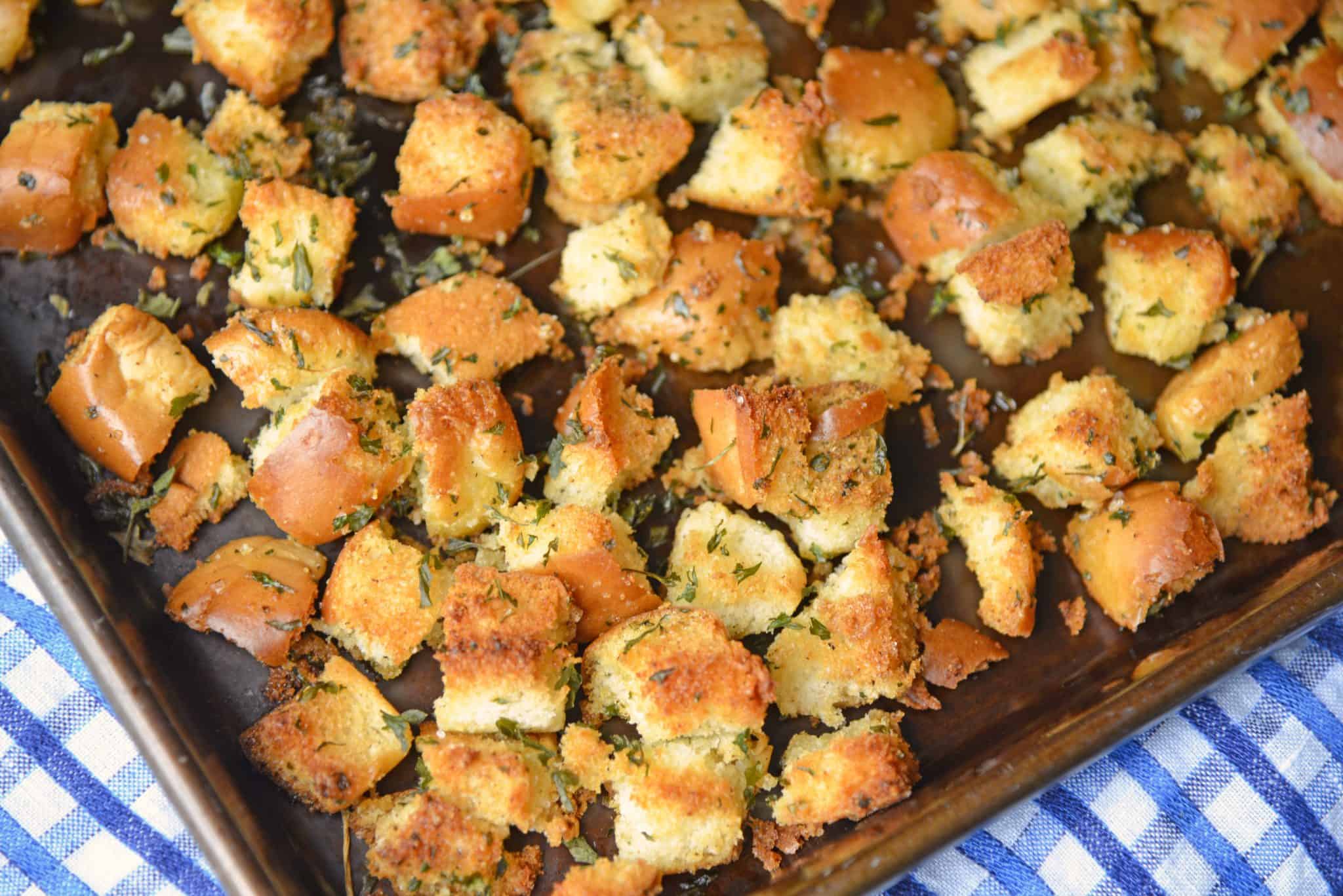 Hot Dog Bun Homemade Croutons with garlic, salt and parsley are the best for salads, soup and more! Learn how to make croutons easily with this crouton recipe. #homemadecroutons #croutonrecipe #howtomakecroutons www.savoryexperiments.com