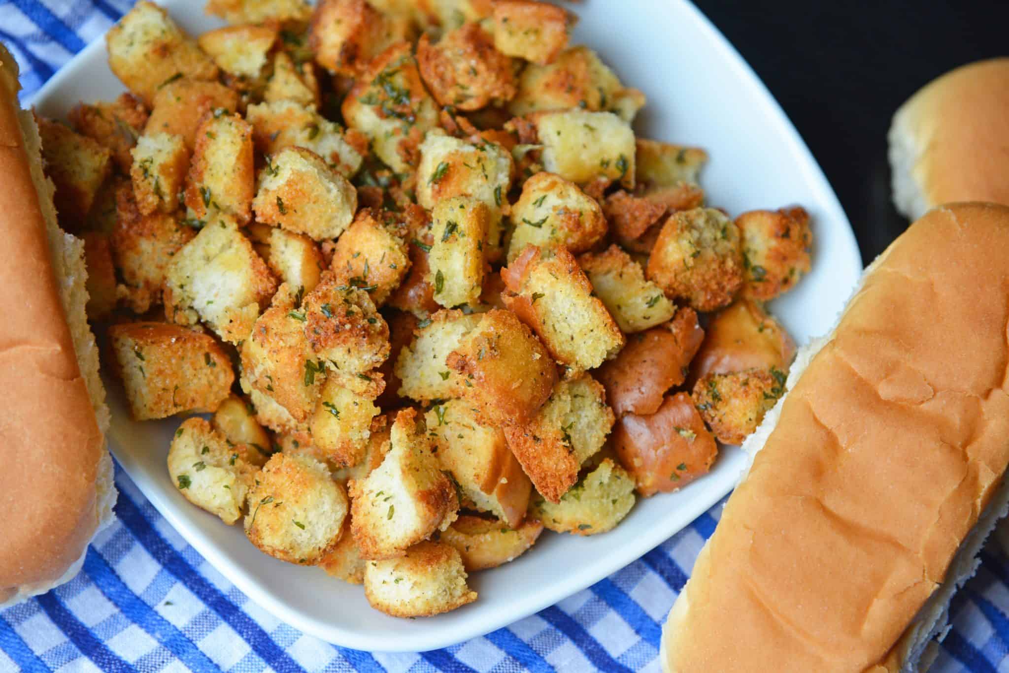 Hot Dog Bun Homemade Croutons with garlic, salt and parsley are the best for salads, soup and more! Learn how to make croutons easily with this crouton recipe. #homemadecroutons #croutonrecipe #howtomakecroutons www.savoryexperiments.com 