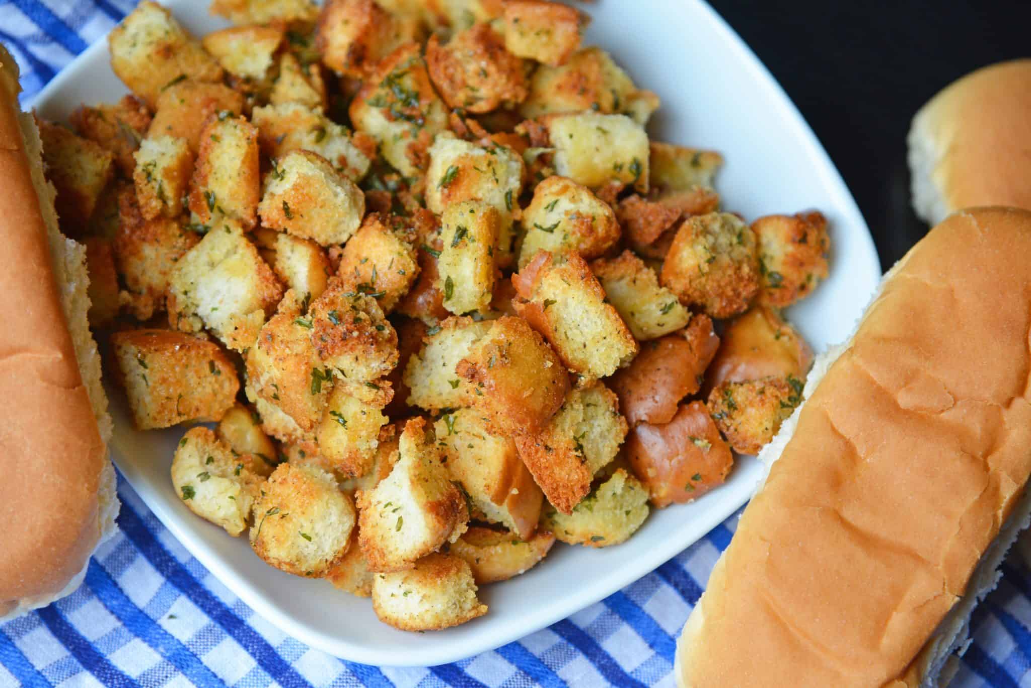 Hot Dog Bun Homemade Croutons with garlic, salt and parsley are the best for salads, soup and more! Learn how to make croutons easily with this crouton recipe. #homemadecroutons #croutonrecipe #howtomakecroutons www.savoryexperiments.com