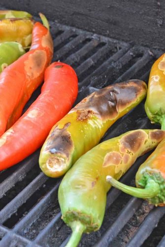 Step-by-step instructions with pictures on how to roast Hatch chile peppers. Roast, peel and seed super easy! #howtoroasthatchchilepeppers #hatchchile www.savoryexperiments.com