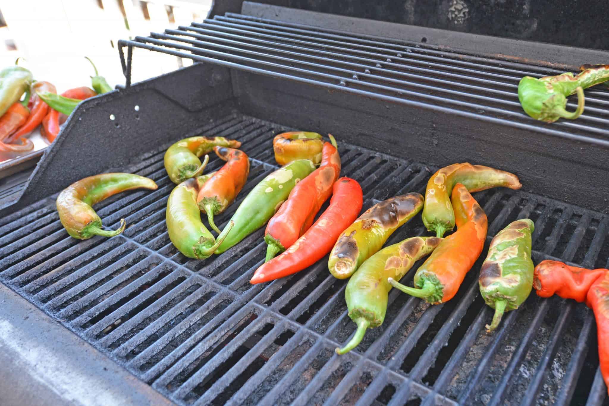 Step-by-step instructions with pictures on how to roast Hatch chile peppers. Roast, peel and seed super easy! #howtoroasthatchchilepeppers #hatchchile www.savoryexperiments.com 