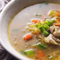 Spaghetti squash noodle soup in a white bowl