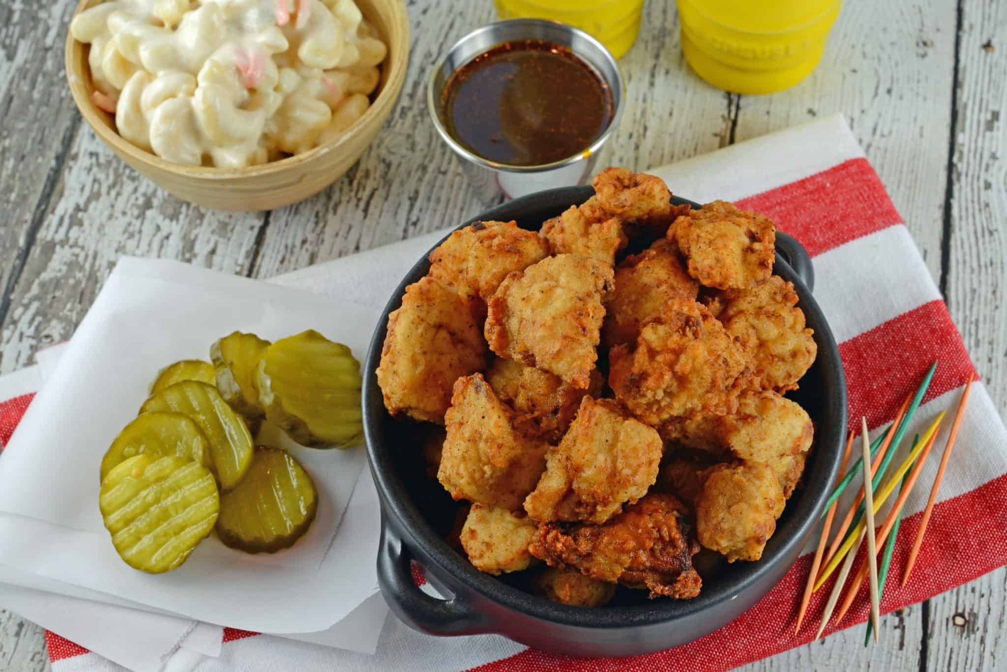 This Popcorn Chicken Recipe is a simple and easy to make deliciously crispy popcorn chicken bites at home. Great for game days, parties or even lunch! #popcornchicken #howtomakepopcornchicken www.savoryexperiments.com 