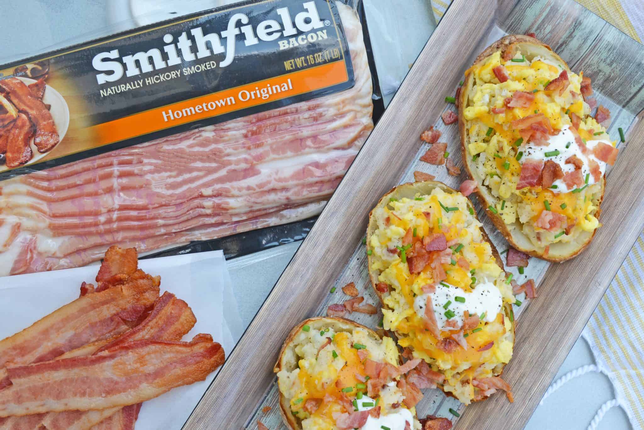 This post is sponsored by Smithfield, however all thoughts and opinions are 100% my own. Seriously? How is it already that time of the year again? It seems like we were just buying pool noodles and now we are looking for backpacks. Twice Baked Breakfast Potatoes use leftover potatoes with scrambled eggs, cheddar cheese, chives, sour cream and BACON for the perfect easy breakfast recipe. And with back to school comes the rigmarole of meal planning. Every meal of the day has its own challenges for different reasons, but one thing stands true, breakfast is the most important meal of the day! Smithfield is so passionate about the importance of breakfast, they have teamed up with No Kid Hungry for the second year in a row, doubling its donation to two million meals to support the organization’s in-school breakfast programs to ensure the 1 in 6 American children struggling with hunger can have a satisfying and quality breakfast too. How can you get involved? Make a Smithfield breakfast and share a photo of it on Facebook, Instagram and Twitter using #BreakfastPower and for every post shared, Smithfield will donate enough for 10 meals to No Kid Hungry. Learn more HERE! Studies show that when students have a hearty and wholesome breakfast in the morning, they are more likely to attend school and perform better on standardized tests making breakfast a powerful learning tool. In fact, when students don’t get the food they need, 76% of teachers see poor academic performance and 80% see the students lose the ability to concentrate (source: No Kid Hungry). Quality of breakfast is just as important as having breakfast, but with a little bit of planning, you can be serving your little ones (or big ones!) a protein-packed breakfast that will fuel them through the morning. My favorite: Twice Baked Breakfast Potatoes! This is my favorite for several reasons. First, I can use leftover baked potatoes to make breakfast. I hate wasting food and also hate eating the same thing, so I can make two meals with the same set of baked potatoes. The second is how easy they are to make and how they can be prepared ahead of time. I go ahead and assemble the whole stuffed potato and then just pop it in the oven for a few minutes to warm them up! Smithfield Hometown Original Bacon provides the protein boost you need as well as scrambled eggs and cheddar cheese, while potatoes give complex carbohydrates and dietary fiber. Smithfield Hometown Original Bacon is smoked and cured and comes in different flavors and cuts like Cherrywood and Thick Cut so you can customize your Twice Baked Breakfast Potatoes. And since bacon makes everything better, I usually make a few extra crispy strips to serve on the side of my potato. If you liked our Twice Baked Breakfast Potato, you’ll love these other breakfast recipes that use bacon too! • Bacon, Egg and Cheese Breakfast Bread • Creamy Cheddar Grits • Stuffed Breakfast Potatoes So really the only question left is do you like your breakfast potatoes and eggs with ketchup, hot sauce or plain? Personally, I like mine plain so I can really taste ALL the flavors! {RECIPE CARD} Potatoes: 2 large russet potatoes, cooked* 2 tablespoons butter, divided 3 eggs, lightly beaten ½ cup Smithfield Hometown Original Bacon, cooked and crumbled 2 tablespoons sour cream ¼ cup cheddar cheese, shredded 1 tablespoon chives, minced ¼ teaspoon garlic powder ¼ teaspoon ground black pepper Toppings: Smithfield Bacon Hometown Original Chives Sour Cream Sea Salt Hot Sauce Ketchup Preheat oven to 350 degrees. In a small skillet, melt 1 tablespoon butter. Add lightly beaten eggs, stirring until scrambled and just cooked. Do not overcook. Set aside. Cut large, cooked potatoes in half lengthwise. Using a spoon, hallow out skins. Place potato pulp in a medium mixing bowl. Place potato skins on a baking sheet. Mash potato pulp with sour cream and 1 tablespoon butter. Stir in shredded cheddar cheese, chives, garlic powder and ground black pepper, mix well. Using two forks, toss scrambled eggs with potato mixture. Do not over mix, just lightly toss. Fill potato skins, mixture will be heaping. Place back into oven for 10 minutes, or until hot all the way through. Immediately top with additional cheddar cheese, crumbled bacon, chives and any additional condiments you desire. If you’ve given our Twice Baked Breakfast Potatoes a try, make sure to come back through and let us know how they were! *Use leftover baked potatoes or pierce your potato several times and microwave for 4-5 minutes. The size of potato and power of your microwave will make cooking time vary greatly, please keep an eye out while it cooks! *Hot potatoes tend to work better. If you are using leftovers, scoop out the potato and heat in the microwave before mashing. {END RECIPE CARD} You can find your own Smithfield Bacon at your local retailer or grocery store! 