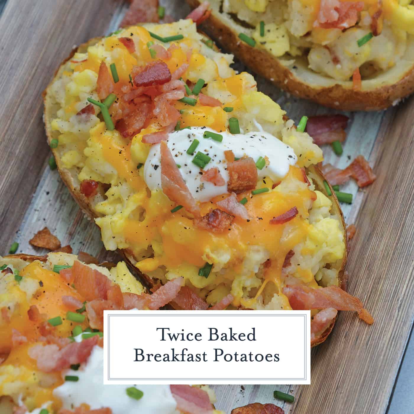 Twice Baked Breakfast Potatoes use leftover potatoes with scrambled eggs, cheddar cheese, chives, sour cream and BACON for the perfect easy breakfast recipe. #breakfastpotatoes www.savoryexperiments.com