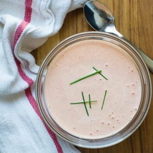 Bell pepper aioli in a glass jar with a white napkin