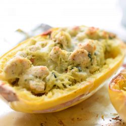 Pesto chicken spaghetti squash cut in half