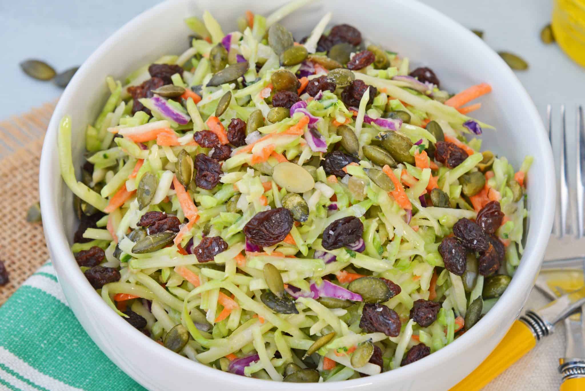 This Crunchy Broccoli Slaw Salad is made with a bagged broccoli slaw and a few extra ingredients for a quick, easy and tasty side salad! #broccolislaw #broccolisalad www.savoryexperiments.com