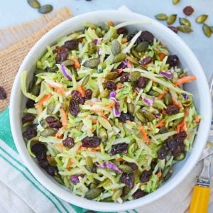 This Crunchy Broccoli Slaw Salad is made with a bagged broccoli slaw and a few extra ingredients for a quick, easy and tasty side salad! #broccolislaw #broccolisalad www.savoryexperiments.com