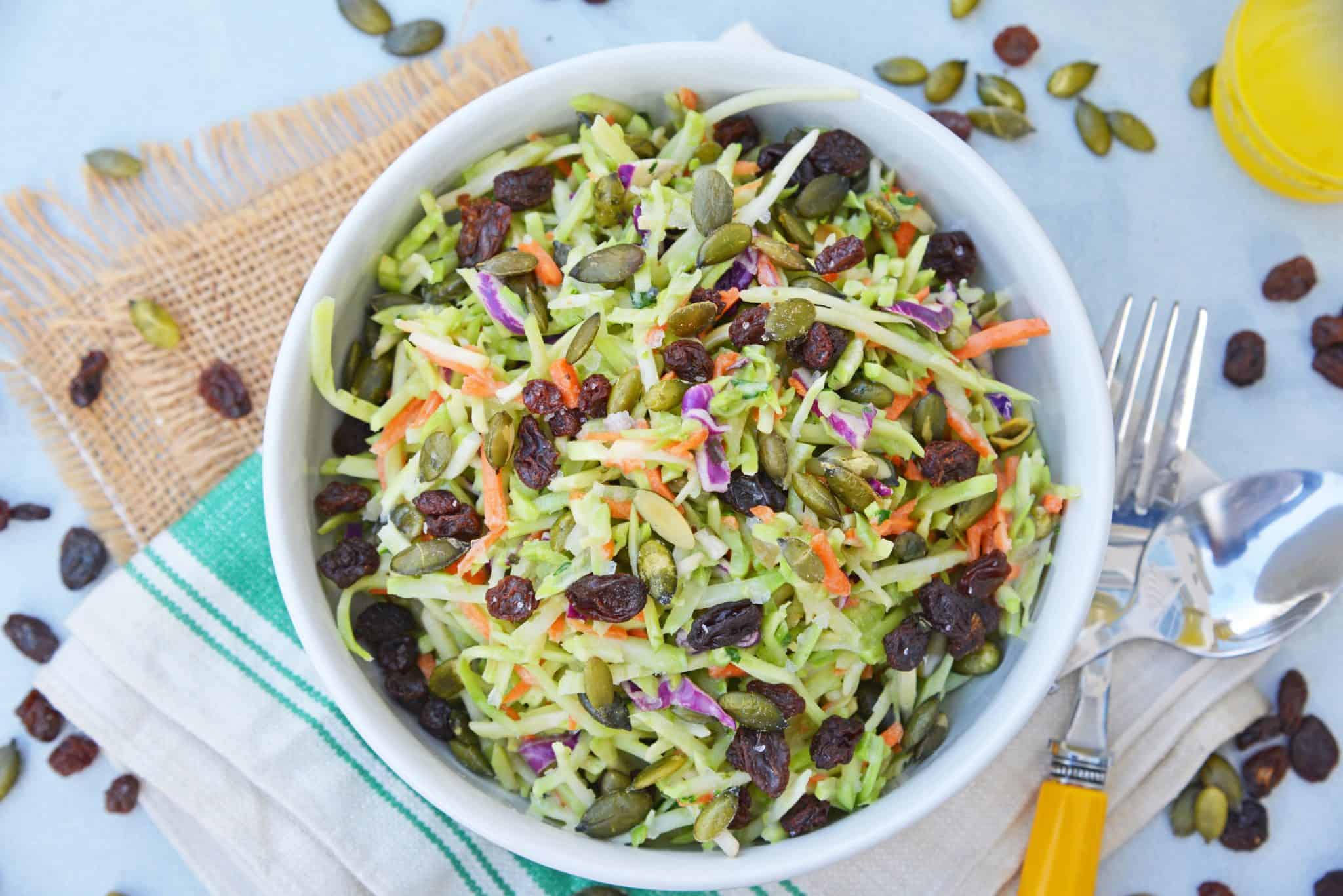 This Crunchy Broccoli Slaw Salad is made with a bagged broccoli slaw and a few extra ingredients for a quick, easy and tasty side salad! #broccolislaw #broccolisalad www.savoryexperiments.com