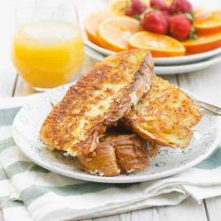 Coconut french toast on a white plate