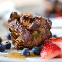 French toast muffin with berries on a plate