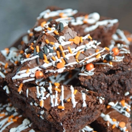 Halloween Brownies are a quick and easy Halloween themed dessert made with box brownie mix, cookie icing and sprinkles. An easy Halloween dessert! #halloweenbrownies #halloweenthemeddesserts #browniemix www.savoryexperiments.com