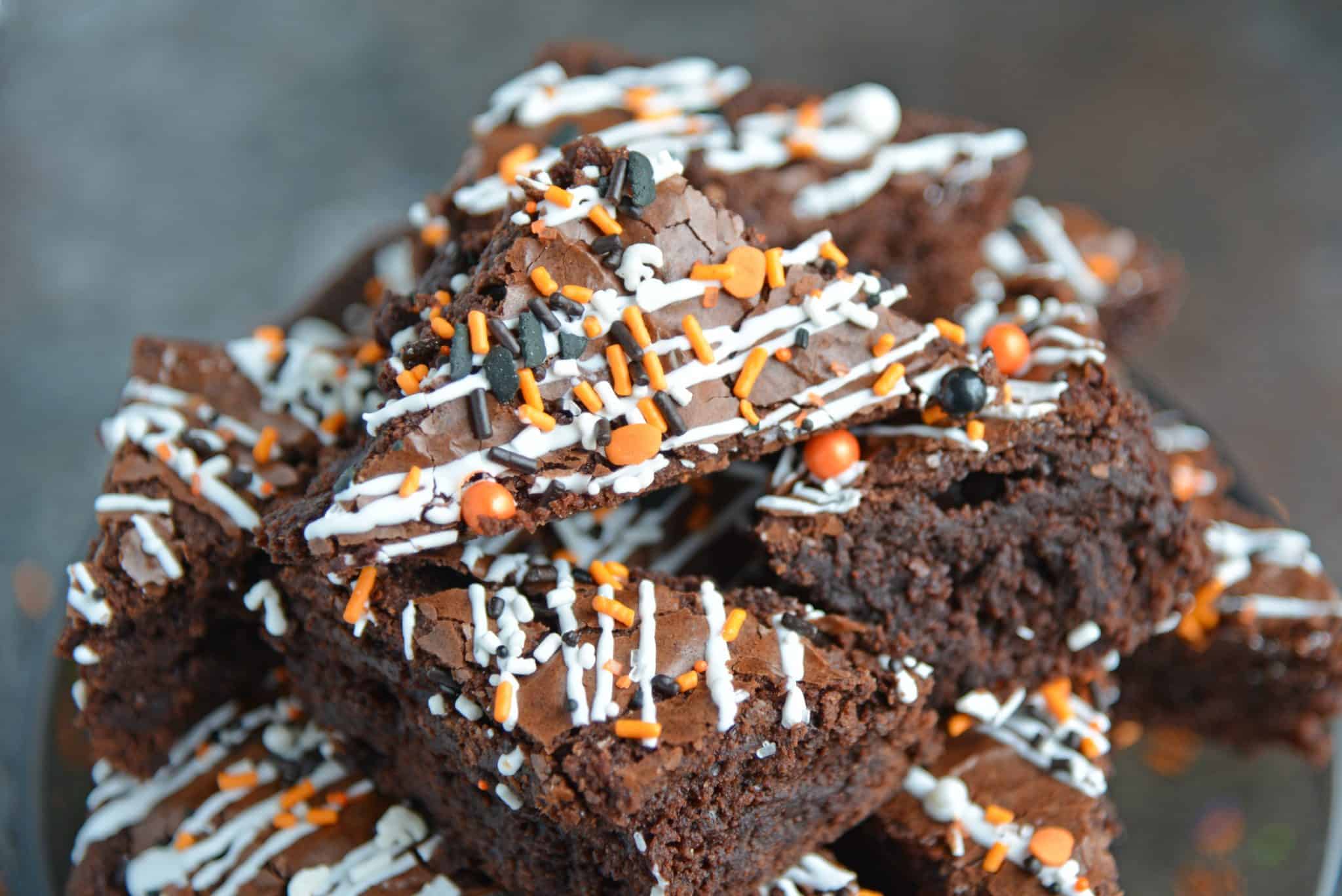 Halloween Brownies are a quick and easy Halloween themed dessert made with box brownie mix, cookie icing and sprinkles. An easy Halloween dessert! #halloweenbrownies #halloweenthemeddesserts #browniemix www.savoryexperiments.com