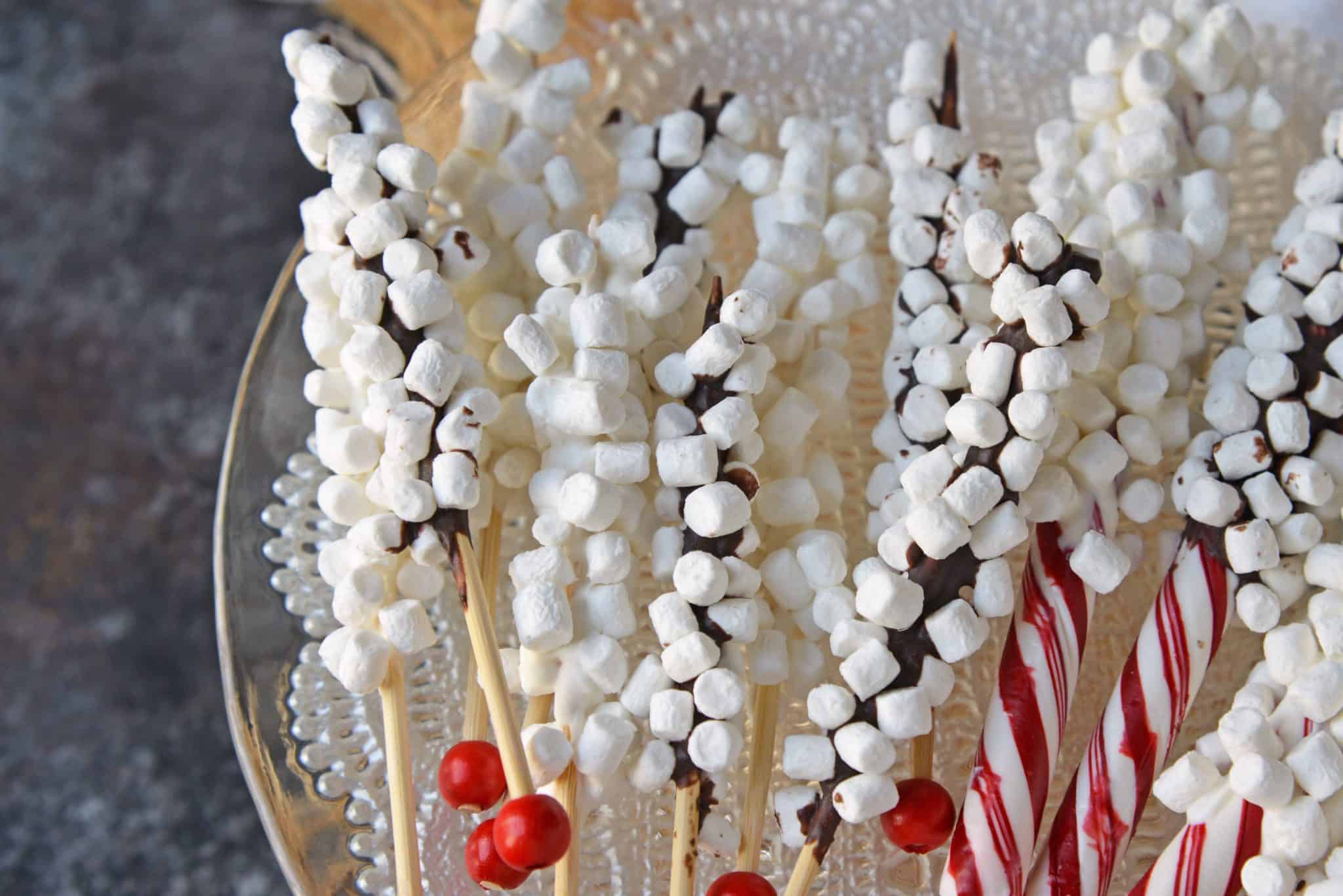 Hot Chocolate Stir Sticks will take your homemade hot chocolate to the next level. Like chocolate spoons, they add marshmallows and more to your drink! #chocolatespoons #hotchocolatestirsticks www.savoryexperiments.com