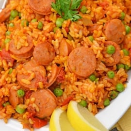 Instant Pot Chicken Paella is based off the traditional Spanish dish. Flavorful & ready in just minutes, this will be your go-to chicken and rice recipe. #chickenpaella #instantpotchickenrecipes #chickenandricerecipe www.savoryexperiments.com